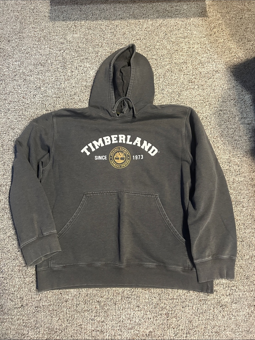 Timberland Dark Charcoal Hoodie with White Logo and Gold Emblem